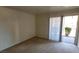 Comfortable bedroom offering natural light through vertical blinds with an outdoor view at 5295 Indian River Dr # 305, Las Vegas, NV 89103