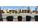 Exterior view showcases a charming community with well-maintained landscaping, sidewalks, and palm trees at 5295 Indian River Dr # 305, Las Vegas, NV 89103