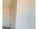 Bright hallway with a door to a room at 5295 Indian River Dr # 305, Las Vegas, NV 89103