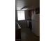 Functional kitchen with white refrigerator, wood cabinets, and ample counter space at 5295 Indian River Dr # 305, Las Vegas, NV 89103