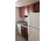 Functional kitchen with white dishwasher and refrigerator and ample counter space at 5295 Indian River Dr # 305, Las Vegas, NV 89103