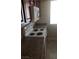 Well-lit kitchen with dark cabinets, granite counters, and modern appliances at 5295 Indian River Dr # 305, Las Vegas, NV 89103