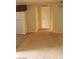 Inviting living room with neutral carpet and a view of the entry door at 5295 Indian River Dr # 305, Las Vegas, NV 89103