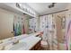 bathroom featuring a shower-tub combination and playful, colorful decor at 6009 Flowering Plum Ave, Las Vegas, NV 89142