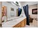 Bright bathroom featuring double sinks, curtains, and lots of countertop space at 6009 Flowering Plum Ave, Las Vegas, NV 89142