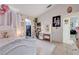 Comfortable bedroom featuring a vanity area and a view into the hall at 6009 Flowering Plum Ave, Las Vegas, NV 89142