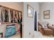 Organized closet with hanging racks and shelves, conveniently located near bedroom at 6009 Flowering Plum Ave, Las Vegas, NV 89142