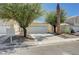 Inviting one-story home with a well-maintained front yard and attached two-car garage at 6009 Flowering Plum Ave, Las Vegas, NV 89142