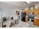 Well-lit kitchen featuring light wood cabinets and tile flooring at 6009 Flowering Plum Ave, Las Vegas, NV 89142