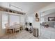 Open kitchen area flowing into a casual dining space and featuring ample natural light at 6009 Flowering Plum Ave, Las Vegas, NV 89142