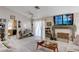 Bright living area with an open layout to the kitchen, lots of light, and a fireplace, great for relaxing at 6009 Flowering Plum Ave, Las Vegas, NV 89142