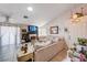 Comfortable living room with a skylight, tile flooring, and bright airy feel at 6009 Flowering Plum Ave, Las Vegas, NV 89142