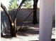 Cozy backyard featuring mature trees, gravel ground cover, and a block wall for privacy at 733 Hitchen Post Dr, Henderson, NV 89011