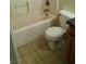Cozy bathroom featuring a bathtub, toilet, and vanity with tile floors at 733 Hitchen Post Dr, Henderson, NV 89011