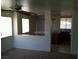 A cozy living room features a view to the kitchen and a window overlooking an exterior at 733 Hitchen Post Dr, Henderson, NV 89011