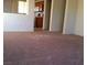 Living room with neutral carpet and an open concept layout with a view to the kitchen at 733 Hitchen Post Dr, Henderson, NV 89011