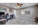 Bright bedroom with a ceiling fan, modern floors, natural light from the window and neutral paint at 902 Dianne Dr, Boulder City, NV 89005