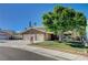 Charming two-story home featuring a three-car garage and mature landscaping at 902 Dianne Dr, Boulder City, NV 89005