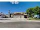 Charming two-story home featuring a three-car garage and mature landscaping at 902 Dianne Dr, Boulder City, NV 89005