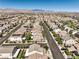 Expansive aerial view of a suburban neighborhood with mountain views and well-maintained homes and streets at 9113 Sea Mink Ave, Las Vegas, NV 89149