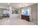 Open-concept dining area with tiled floors seamlessly connecting to the living room at 9113 Sea Mink Ave, Las Vegas, NV 89149