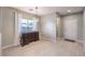 Inviting dining area with tile floors, modern light fixture, and a decorative dresser at 9113 Sea Mink Ave, Las Vegas, NV 89149