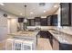 Bright kitchen with granite counters, tiled backsplash, stainless appliances, and a pendant light over the island at 9113 Sea Mink Ave, Las Vegas, NV 89149