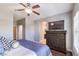 This is a nice main bedroom with a TV, dresser and ensuite bath at 9113 Sea Mink Ave, Las Vegas, NV 89149