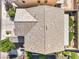 Close up aerial view of a house roof, small backyard with synthetic grass and landscaping in a neighborhood at 9113 Sea Mink Ave, Las Vegas, NV 89149