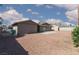 Expansive backyard with desert landscaping and a small patio area at 922 Westminster Ave, Las Vegas, NV 89119
