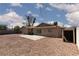 Large backyard featuring desert landscaping, a small patio, and minimal maintenance at 922 Westminster Ave, Las Vegas, NV 89119