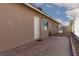 Rear exterior of the home featuring a paved patio area and desert landscaping at 922 Westminster Ave, Las Vegas, NV 89119