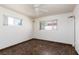 A bedroom featuring tile flooring, ceiling fan and windows at 922 Westminster Ave, Las Vegas, NV 89119