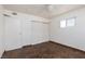 Bedroom features wood-look flooring, ceiling fan and closet at 922 Westminster Ave, Las Vegas, NV 89119