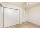 Bedroom featuring tiled flooring, ceiling fan, and closet space at 922 Westminster Ave, Las Vegas, NV 89119