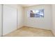 Neutral bedroom with tiled flooring, a window and closet at 922 Westminster Ave, Las Vegas, NV 89119