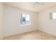 Bright bedroom with tiled floors, a ceiling fan and dual windows at 922 Westminster Ave, Las Vegas, NV 89119