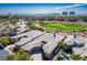 Stunning aerial view showcases the community's golf course and upscale residences at 9233 Canyon Mesa Dr, Las Vegas, NV 89144