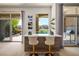 An elegant bar area offers a stylish transition to an outdoor space, perfect for entertaining guests at 9233 Canyon Mesa Dr, Las Vegas, NV 89144