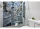 Modern bathroom featuring a shower with sleek tile work and modern fixtures at 9233 Canyon Mesa Dr, Las Vegas, NV 89144