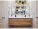 Elegant bathroom featuring a double vanity with modern sinks and a stylish mirror at 9233 Canyon Mesa Dr, Las Vegas, NV 89144