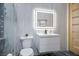 Modern bathroom featuring a sleek vanity, illuminated mirror, and stylish fixtures at 9233 Canyon Mesa Dr, Las Vegas, NV 89144