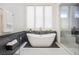 Modern bathroom featuring a luxurious soaking tub and a separate glass-enclosed shower at 9233 Canyon Mesa Dr, Las Vegas, NV 89144