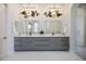 Modern bathroom featuring dual sinks, sleek cabinetry, designer fixtures, and elegant lighting at 9233 Canyon Mesa Dr, Las Vegas, NV 89144
