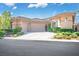 Charming single story home with a desert rock garden and a three car garage and well-maintained landscaping at 9233 Canyon Mesa Dr, Las Vegas, NV 89144