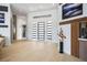 Bright foyer with wood floors and modern black and white accents create a welcoming entrance at 9233 Canyon Mesa Dr, Las Vegas, NV 89144