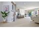 Open-concept living room with white walls and wood accents, seamlessly blending style and comfort at 9233 Canyon Mesa Dr, Las Vegas, NV 89144