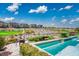 Beautiful pool and spa with views of the golf course and mountains create a serene backdrop for outdoor enjoyment at 9233 Canyon Mesa Dr, Las Vegas, NV 89144