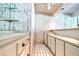 Wet bar area features vintage wood paneling and plentiful cabinet space at 940 Vegas Valley Dr, Las Vegas, NV 89109
