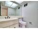 Bathroom with vanity, sink, toilet, and a mirrored medicine cabinet at 940 Vegas Valley Dr, Las Vegas, NV 89109